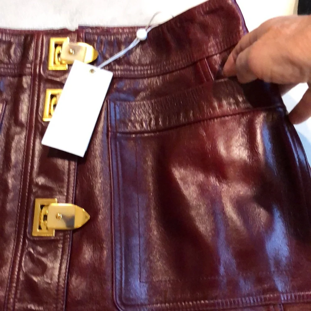 Tory Burch burgundy leather skirt with gold clasps on front - Picture 5 of 8